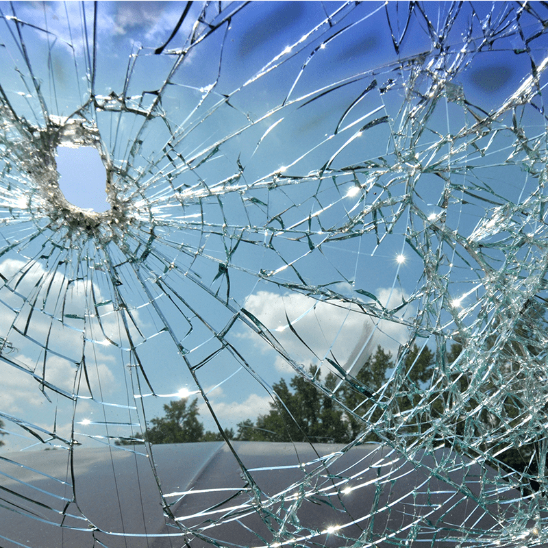 Close-up of a car's smashed windscreen